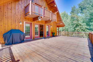 Wooden deck featuring grilling area