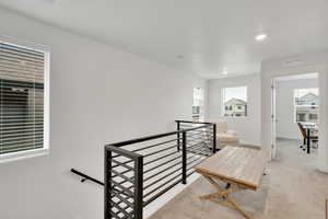 Staircase with baseboards, carpet flooring, visible vents, and recessed lighting