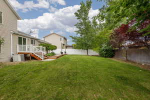 View of yard with a deck