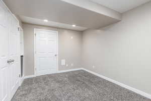 Unfurnished bedroom featuring recessed lighting, carpet flooring, and baseboards