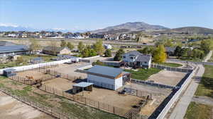 Flat lot with amazing views of horses from all angles of the back of the home