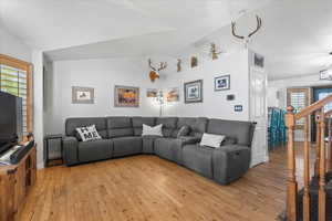 Vaulted ceilings and hardwood flooring throughout main entertaining areas