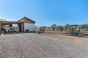 Large barn and covered parking for horse trailer/RV parking