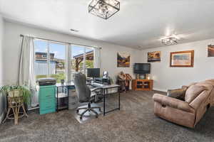 Large room that could be used as family room or office. It features beautiful views of the horses and backyard space
