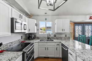 Beautiful view of the horses and property from the sink; sink is stainless steel
