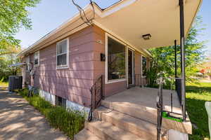 Exterior space featuring central AC and a porch