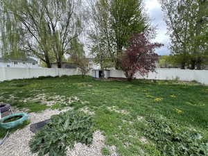 View of yard featuring fence