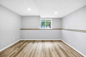 Updated basement family room with recessed lighting