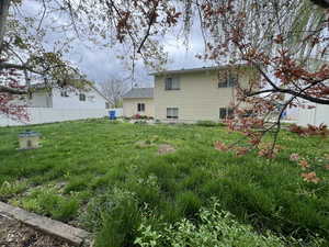 View of yard featuring fence