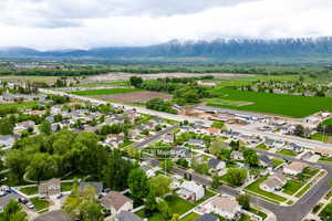Aerial view of residential area featuring a mountain backdrop