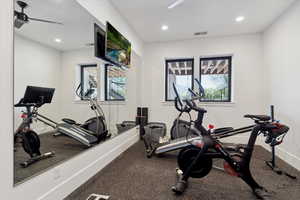 Workout area with visible vents, a healthy amount of sunlight, and recessed lighting