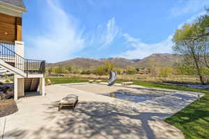 Surrounding community featuring a patio and a mountain view