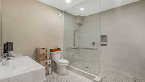 Full bathroom featuring toilet, visible vents, recessed lighting, a walk in shower, and tile patterned flooring