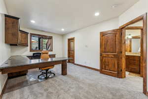 Office area featuring baseboards, recessed lighting, and light colored carpet