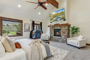 Carpeted bedroom featuring high vaulted ceiling, a stone fireplace, beamed ceiling, access to outside, and recessed lighting