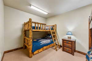 Bedroom with carpet and baseboards