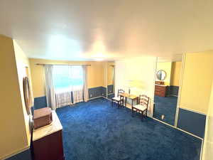 Master room featuring dark carpet