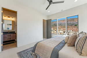 Carpeted bedroom featuring a sink, ensuite bathroom, visible vents, recessed lighting, and ceiling fan