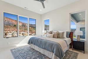 Carpeted bedroom featuring ceiling fan, baseboards, visible vents, and recessed lighting