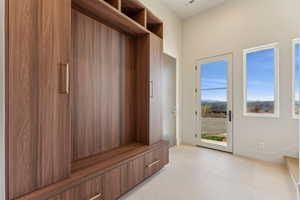 Mudroom featuring light tile patterned floors and visible vents