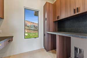 Interior space featuring baseboards and a healthy amount of sunlight
