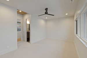 Spare room featuring ceiling fan, carpet flooring, recessed lighting, and visible vents