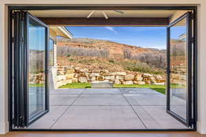 Doorway to outside featuring a mountain view