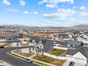 Birds eye view of property with a residential view and a mountain view