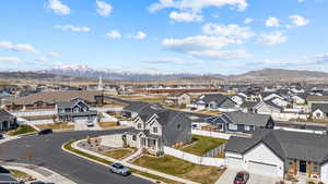 Birds eye view of property with a residential view and a mountain view