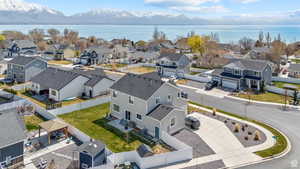 Aerial view featuring a water and mountain view and a residential view
