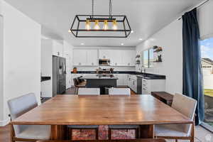Dining space featuring recessed lighting