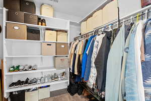 Walk in closet with visible vents