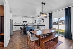 Dining space featuring recessed lighting and dark wood finished floors