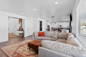 Living room featuring wood finished floors and recessed lighting