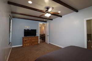 Bedroom featuring carpet floors, recessed lighting, baseboards, and beam ceiling