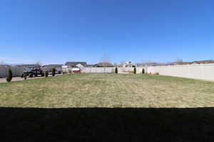 View of yard with a residential view and a fenced backyard