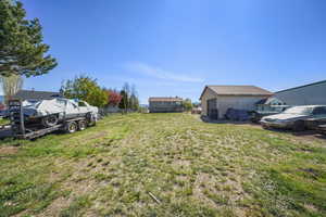 View of yard with fence and a detached garage