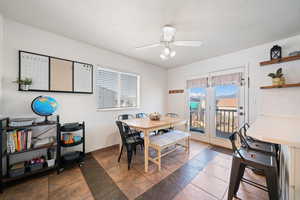 Dining area featuring baseboards and ceiling fan