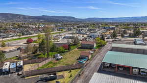 Birds eye view of property featuring a residential view and a mountain view