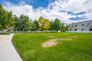 View of yard with fence and a residential view