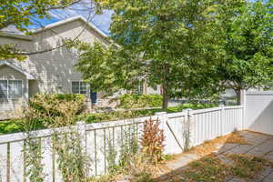 View of property exterior featuring fence private yard