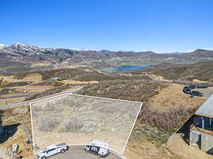 Property view of mountains featuring a water view