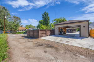 Detached garage featuring  pass through doors.