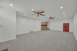 Unfurnished living room featuring a built in safe.