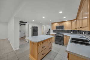 Kitchen featuring island.