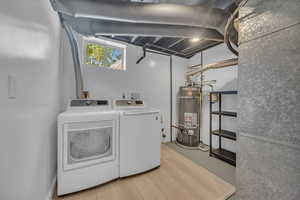 Laundry area featuring washer and clothes dryer and space for a sink.