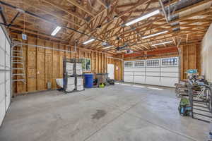 Large 4 car garage interior with a pass through garage doors