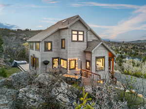 View of front of house featuring roof with shingles