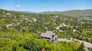 Aerial view of residential area featuring a mountainous background