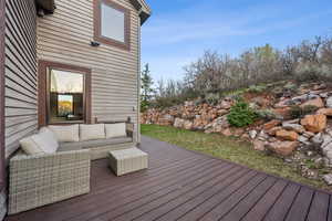 Wooden terrace with an outdoor living space